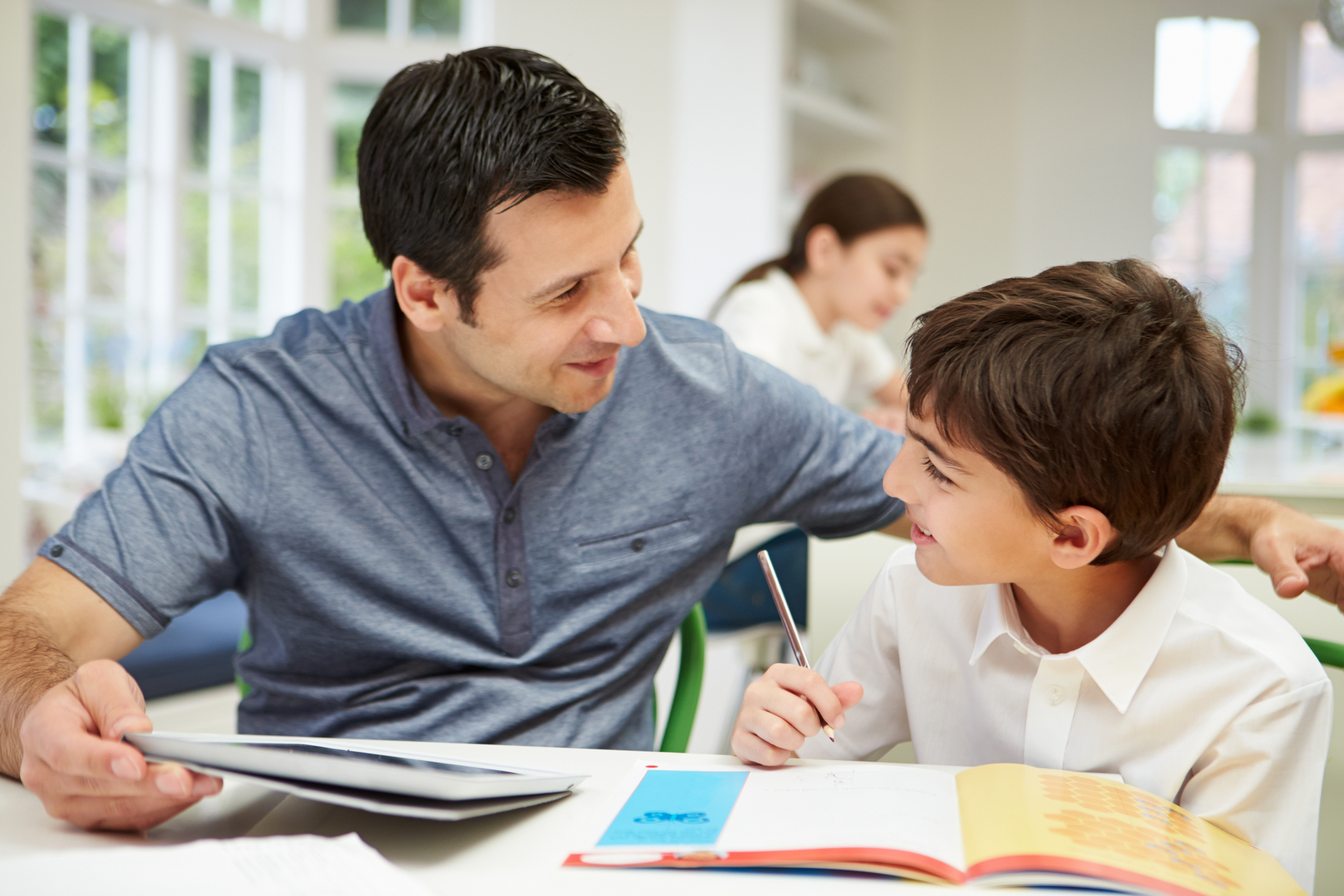 Decorative; Male Teacher Helping Boy